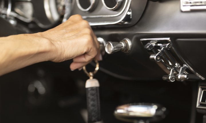Woman inserting key into ignition