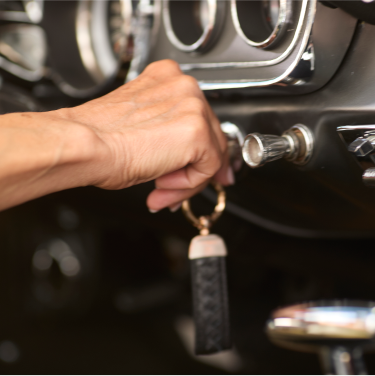 Woman inserting key into ignition