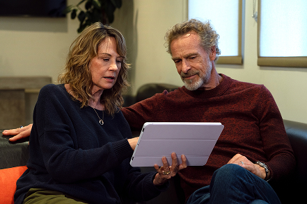 Image of woman and man looking at iPad